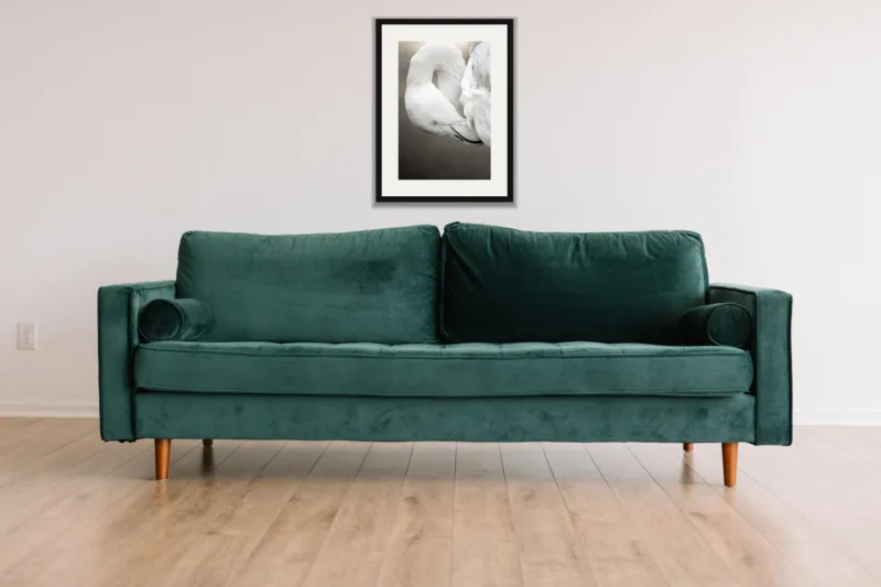 Folded shown framed as an A3 print, above a green velvet sofa against a white wall