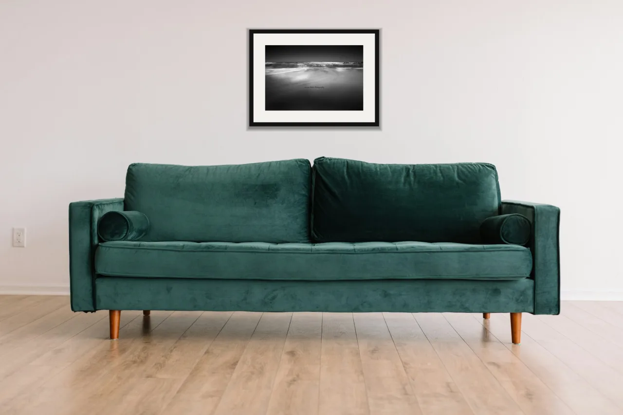 Tide line as a framed A3 print, above a green velvet sofa against a white wall